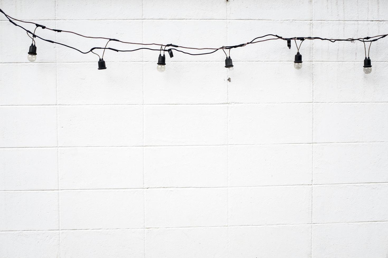 White cement wall background with bulb photo