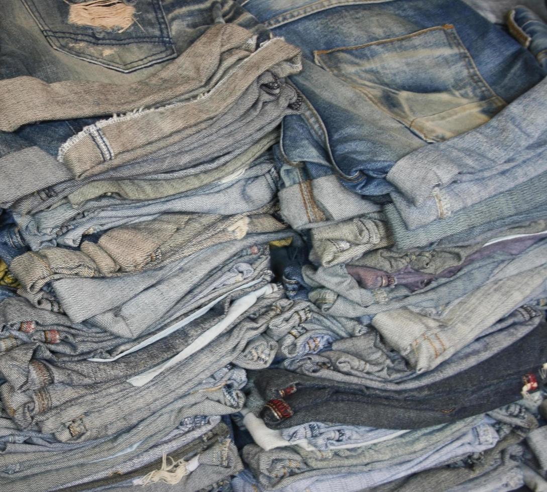 A stack of blue jeans photo