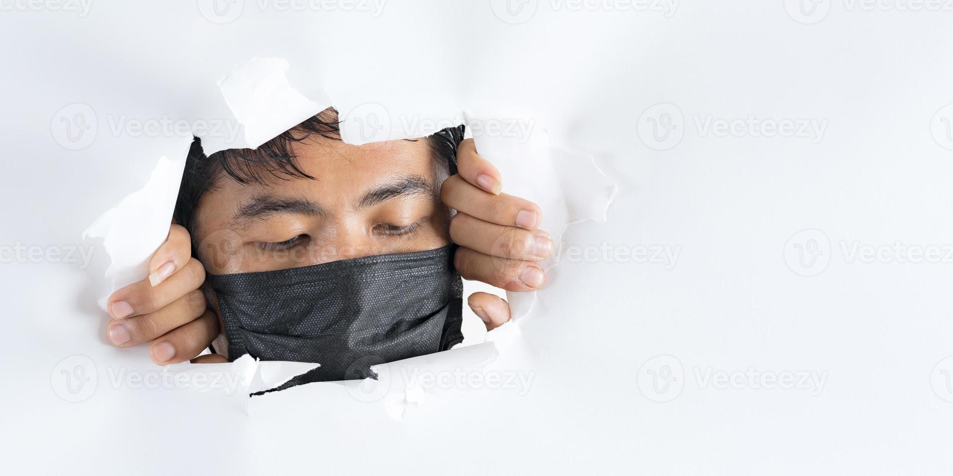 Close up portrait of man wearing protection face mask against coronavirus photo