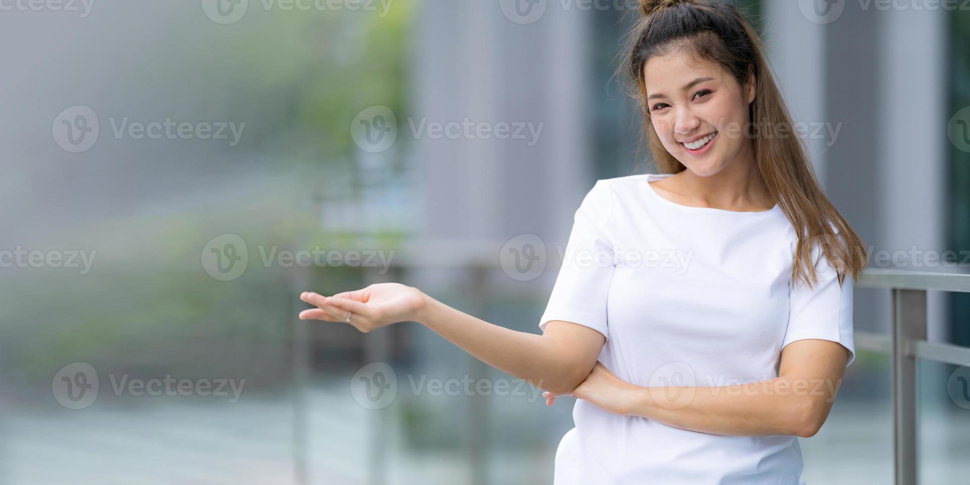 Woman in white t shirt and blue jeans photo