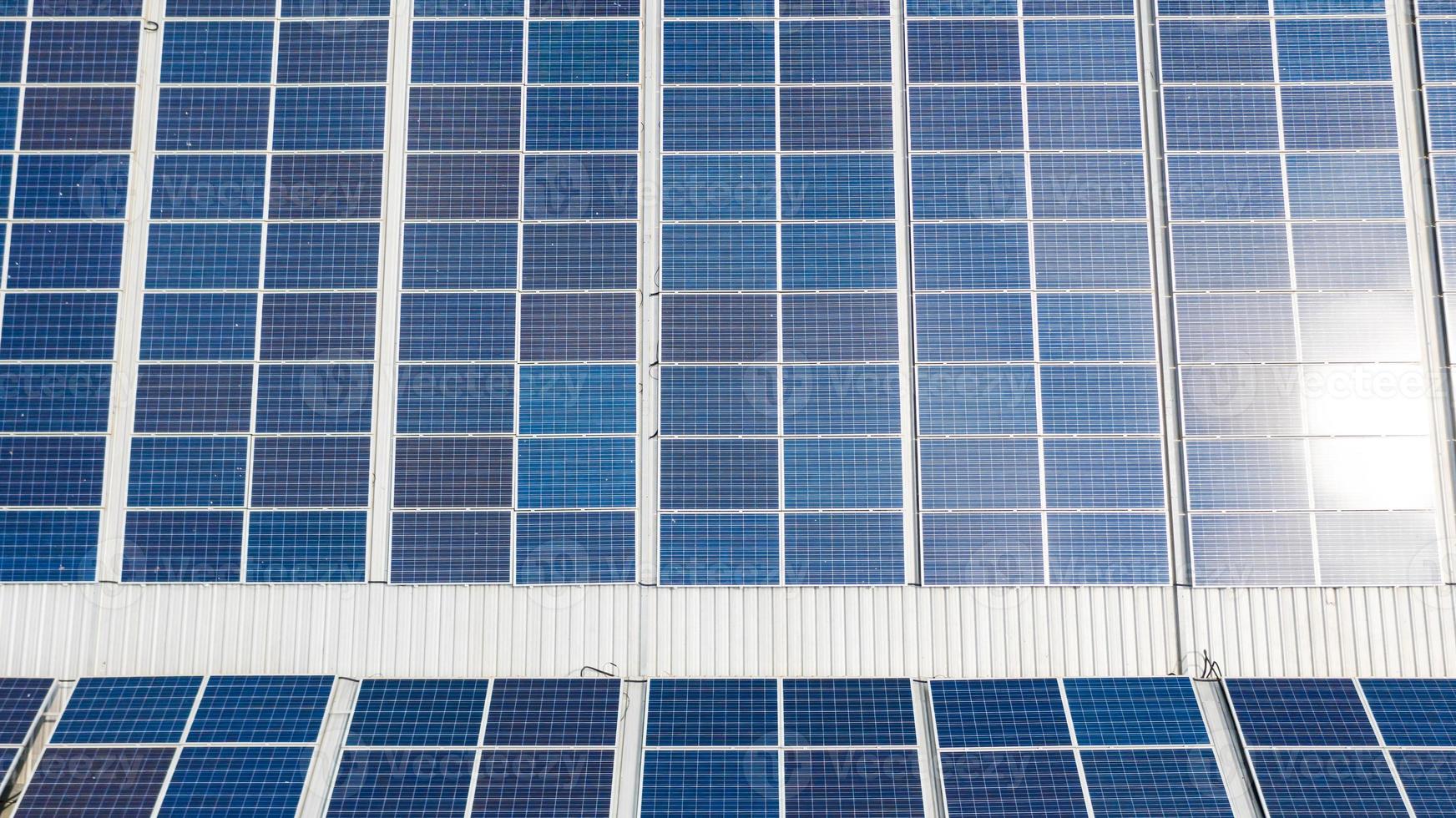 Aerial top view of the solar cells on the roof photo