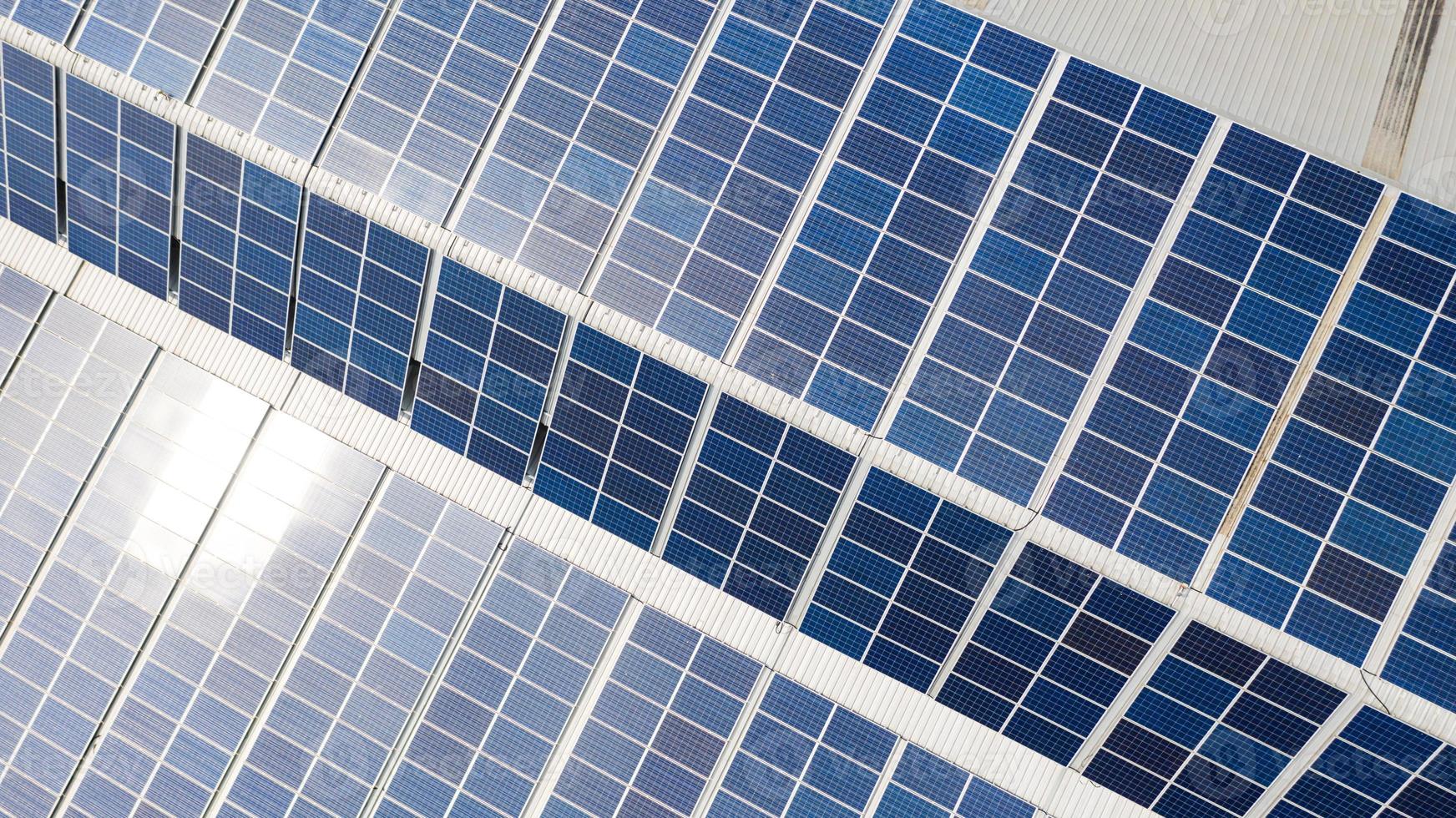 Aerial top view of the solar cells on the roof photo