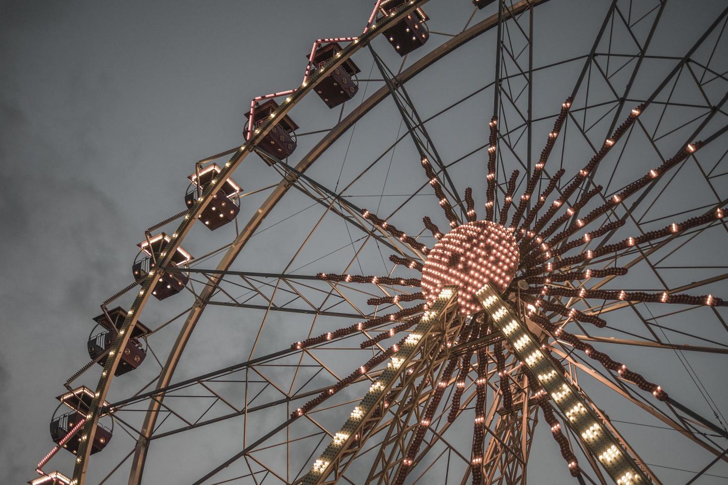 Ferris wheel in a night park entertainment in the park photo