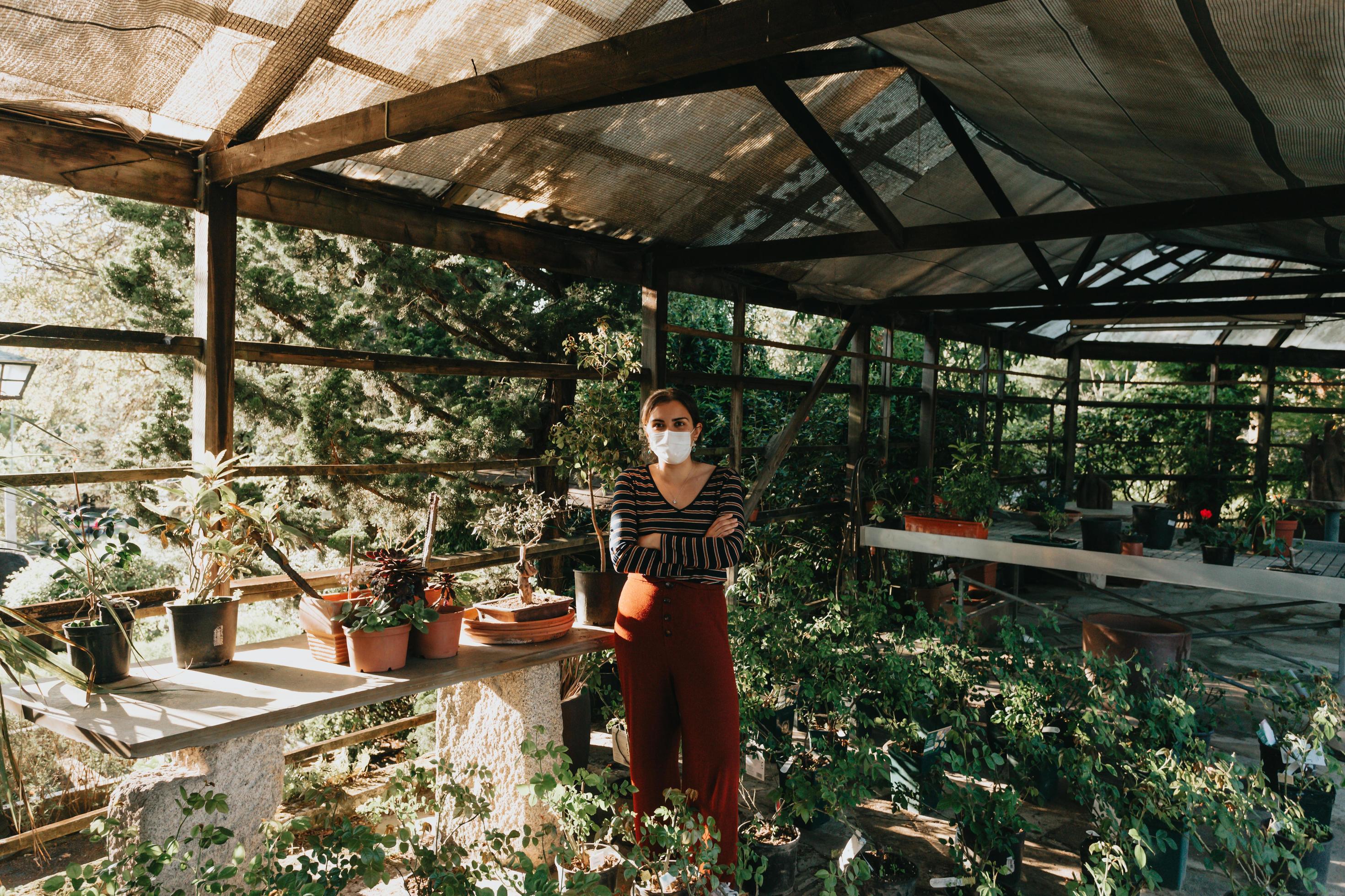A woman wearing a mask doing some gardening photo