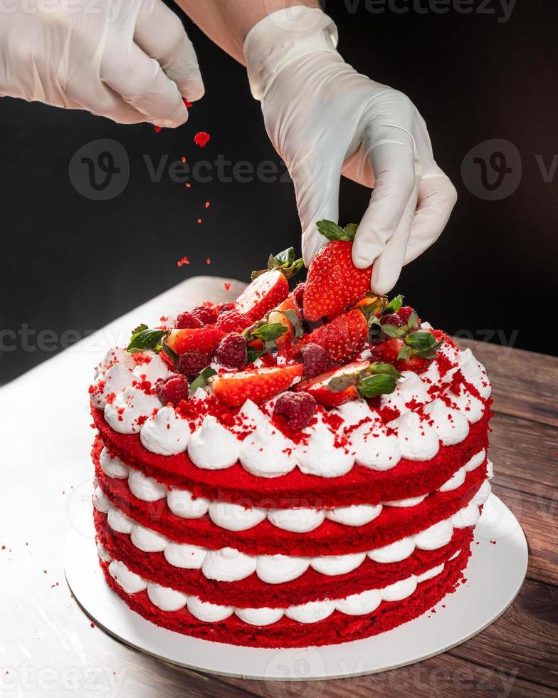 Tasty red strawberry chocolate cake, pouring ingredients photo