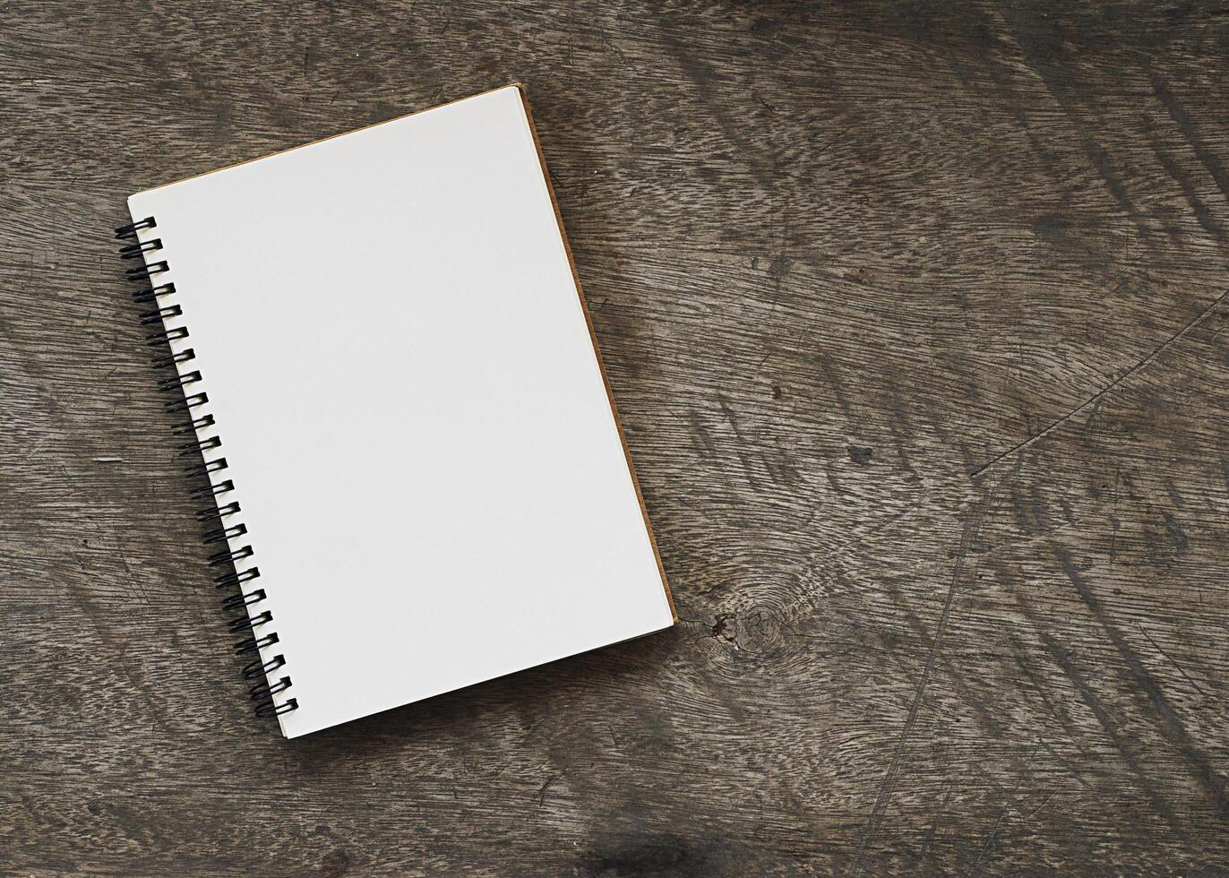 Book notes on wooden background photo