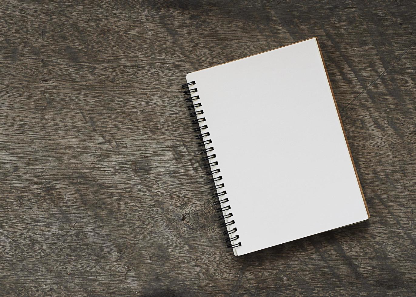 Book notes blank page on wooden background photo