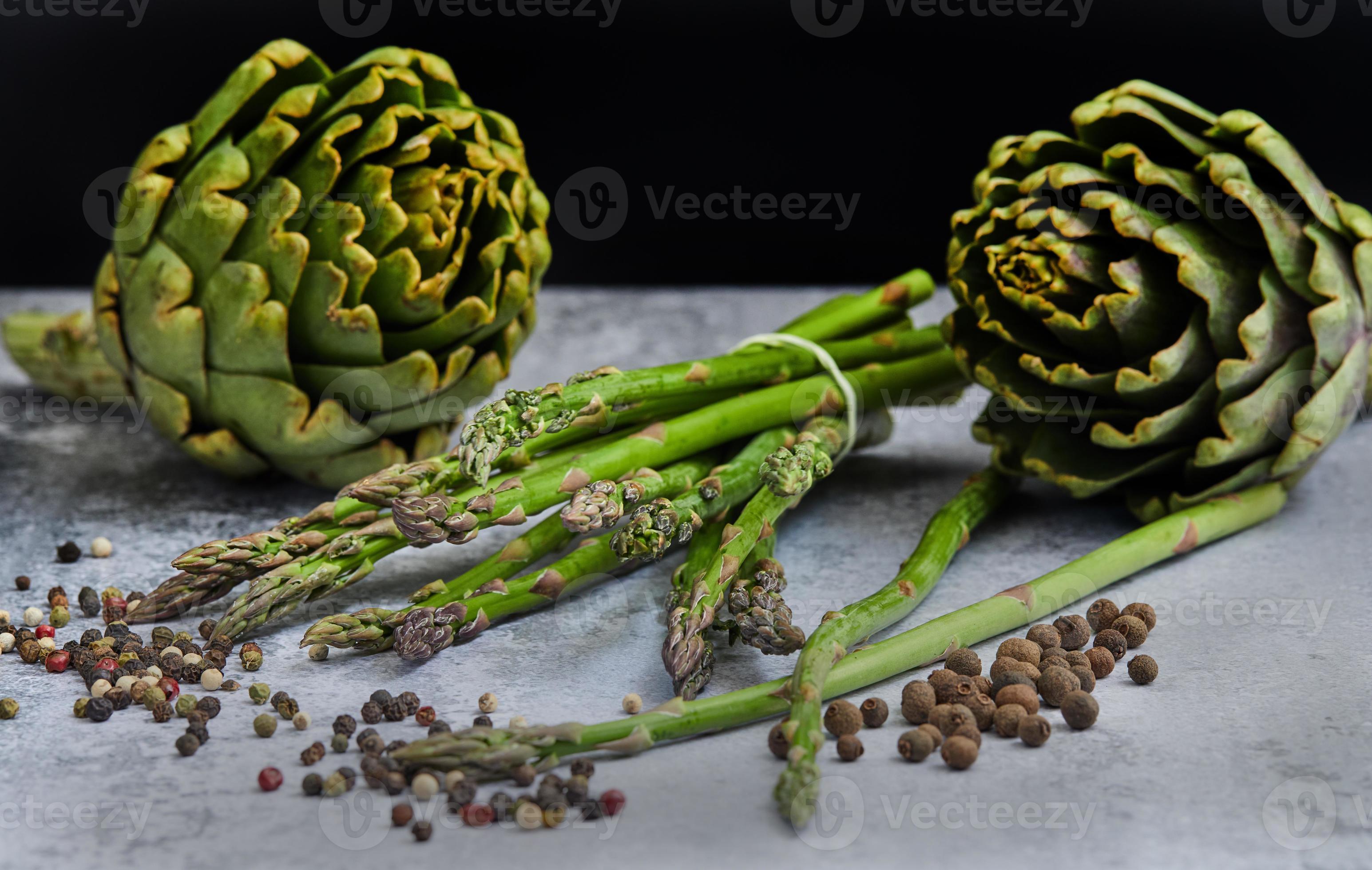 Asparagus and artichokes with herbs 2509799 Stock Photo at Vecteezy