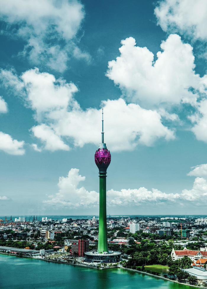 Lotus Tower and cityscape with cloudy blue sky in Sri Lanka photo