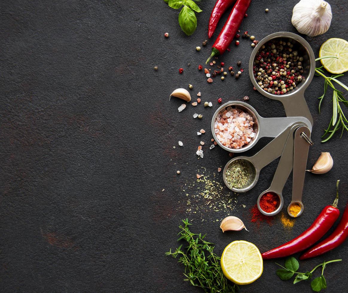 Variety of colorful spices in spoons photo