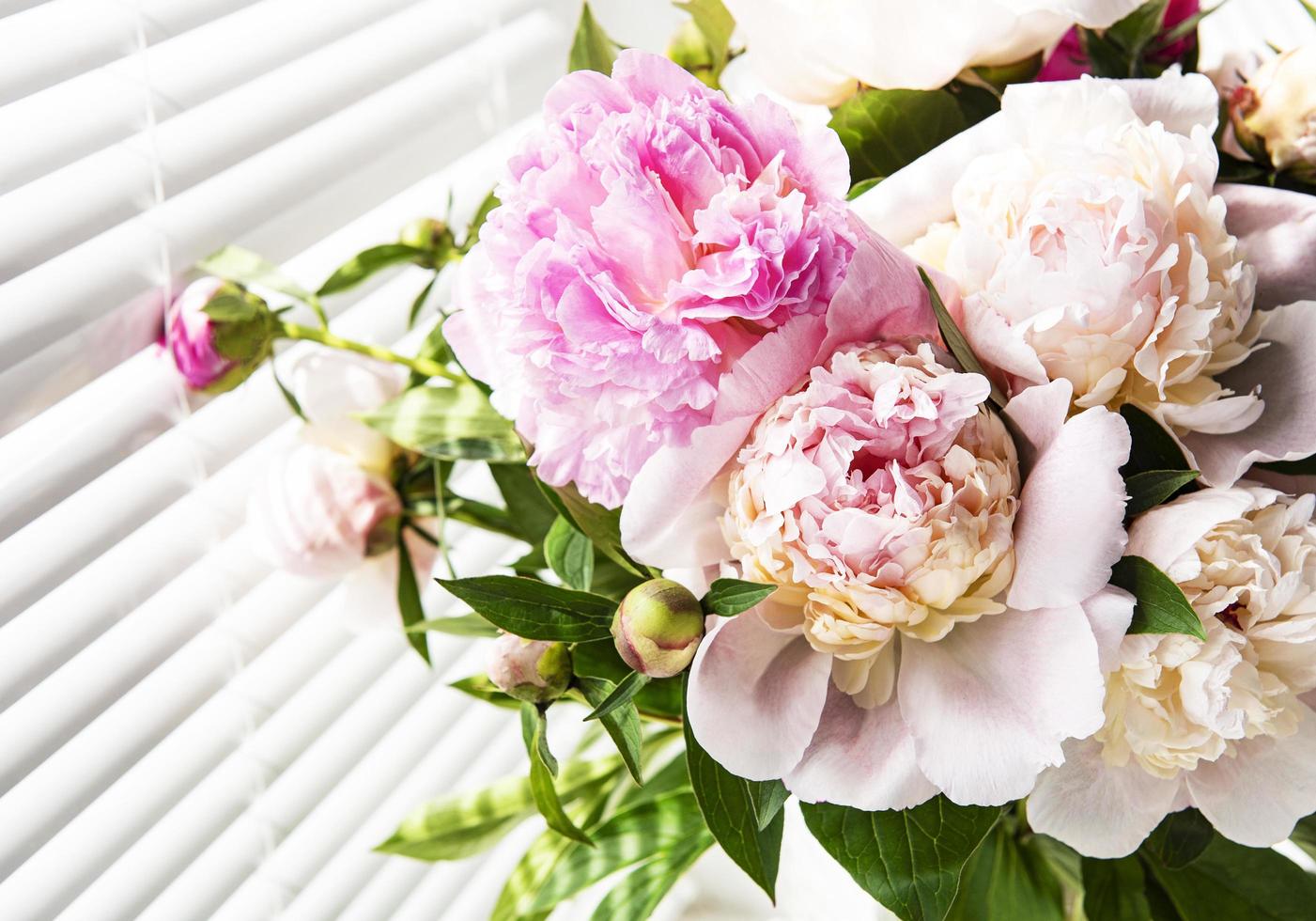 Beautiful pink peony bouquet in a vase. photo