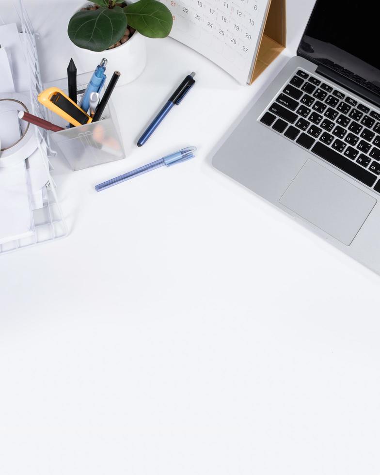 Top view office table desk and workspace with blank on white background photo