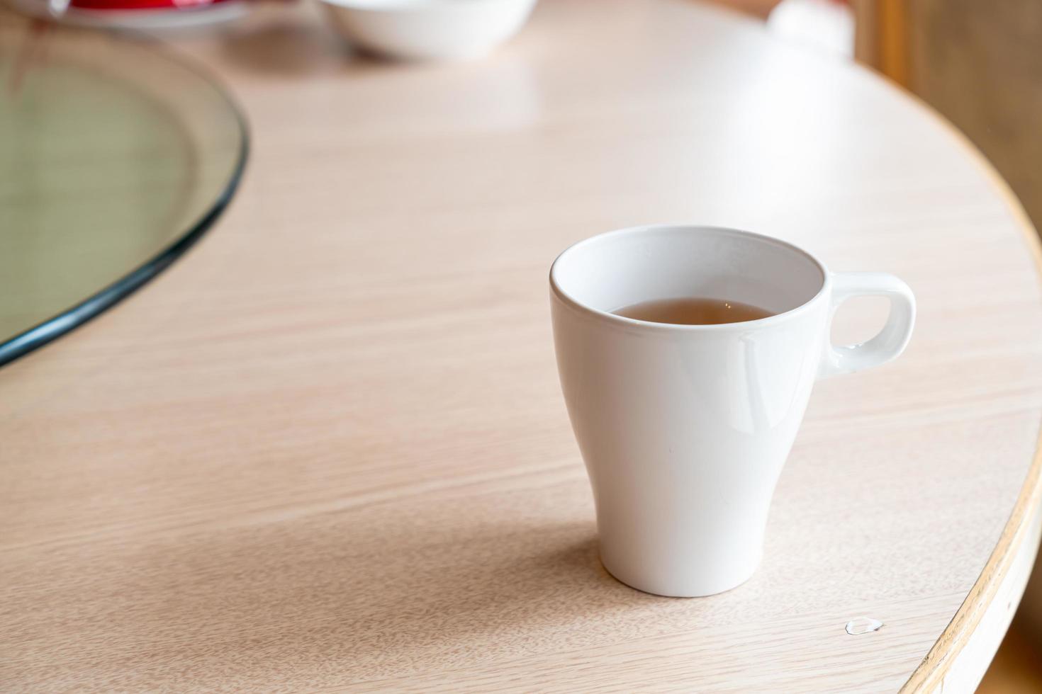 Hot tea cup on table in a restaurant photo