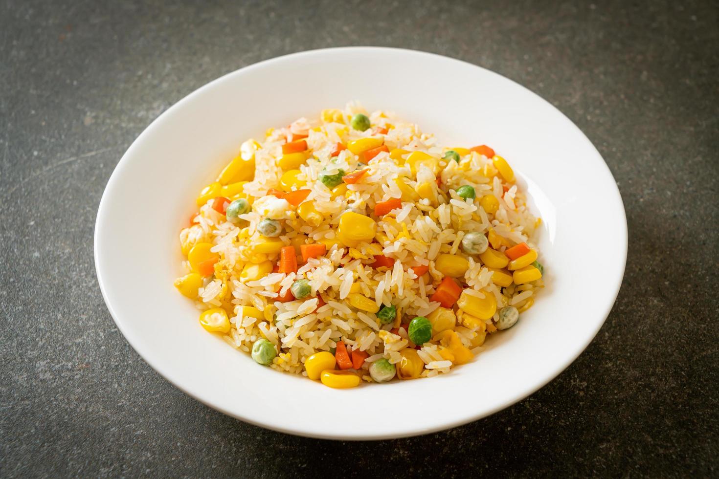 Homemade fried rice with mixed vegetables and egg photo