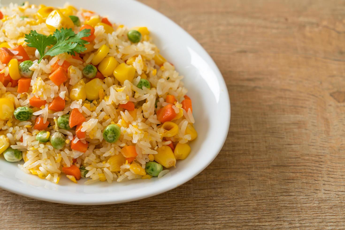 Homemade fried rice with mixed vegetables and egg photo