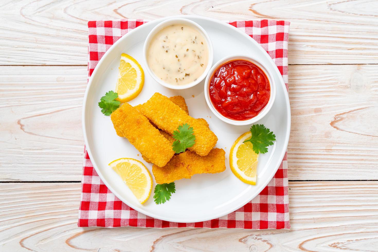 Fried fish finger sticks or french fries fish with sauce photo