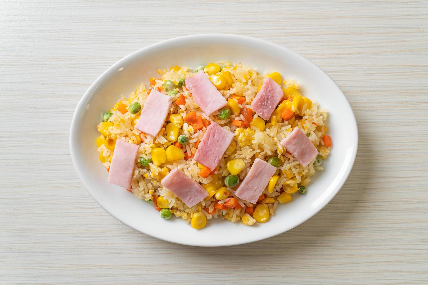 Homemade fried rice with ham and mixed vegetables photo