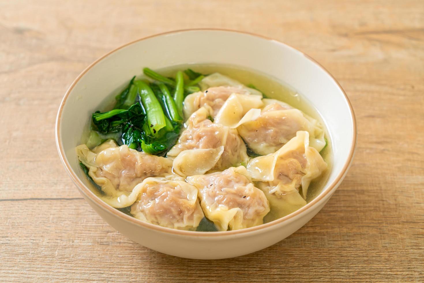 Pork wonton soup or pork dumplings soup with vegetable - Asian food style photo