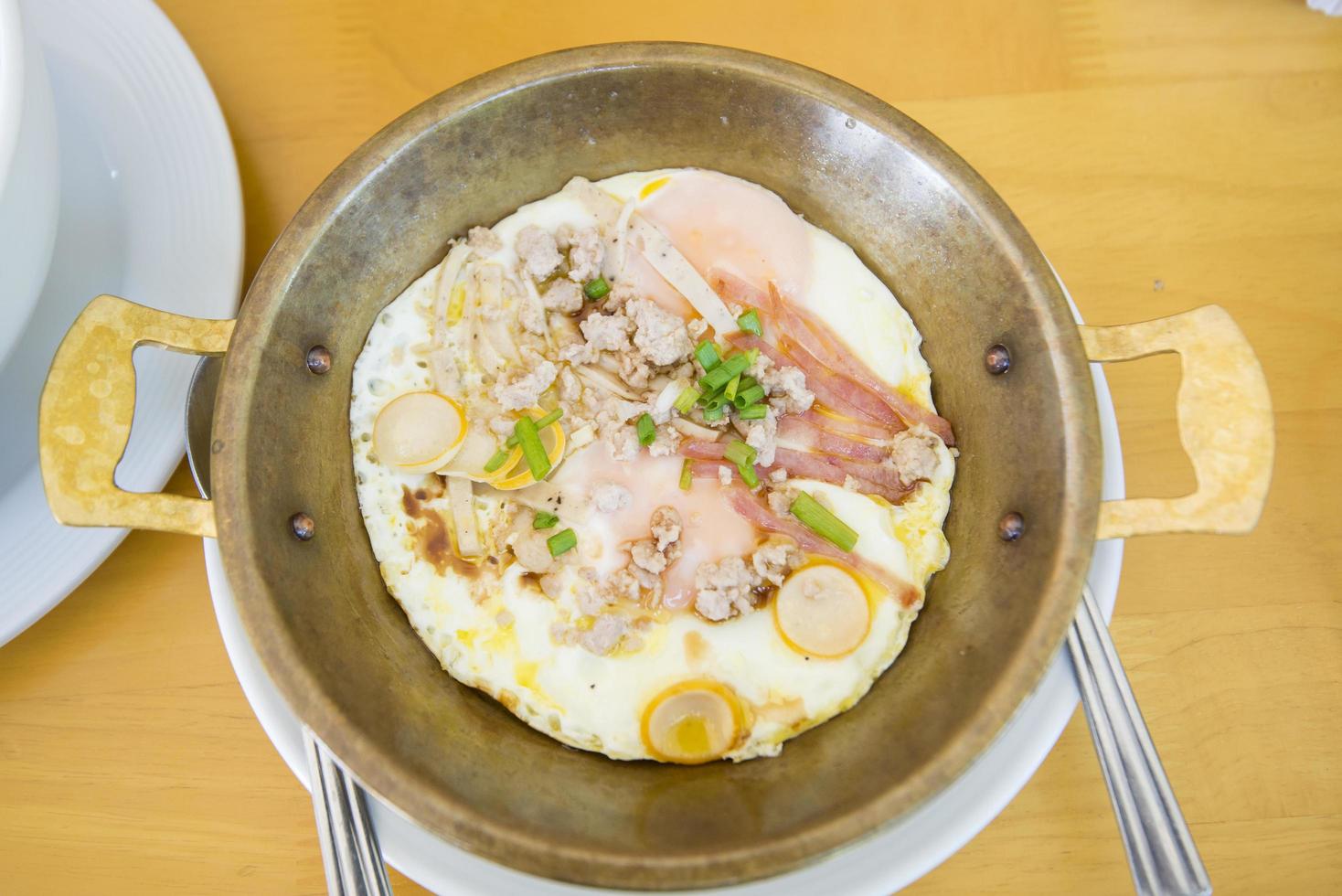 Egg omelet in wok photo