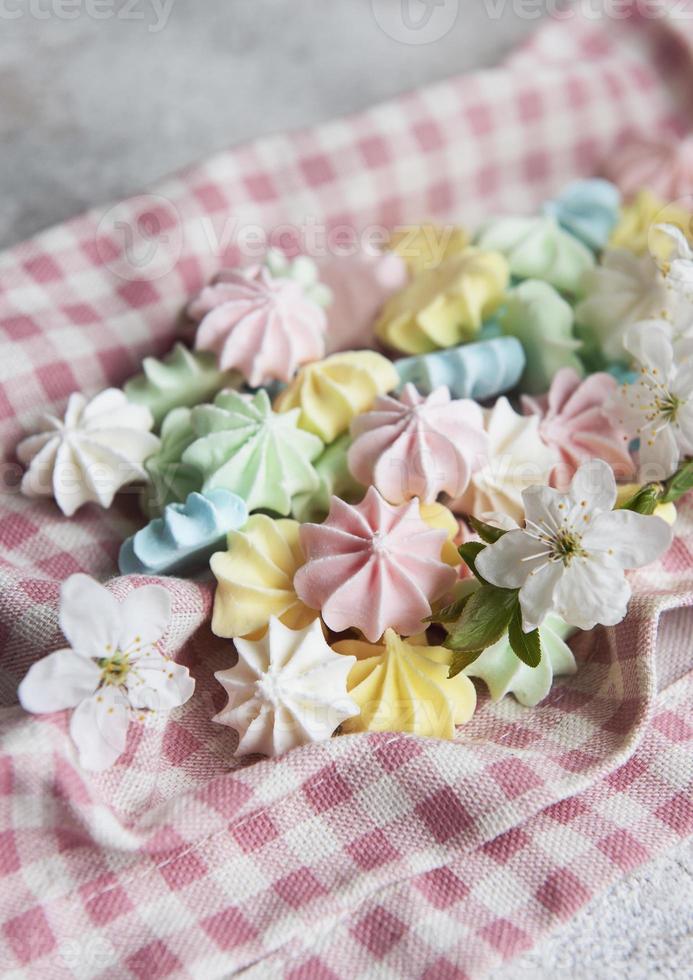 Close up delicious meringue cookies pastel colors photo