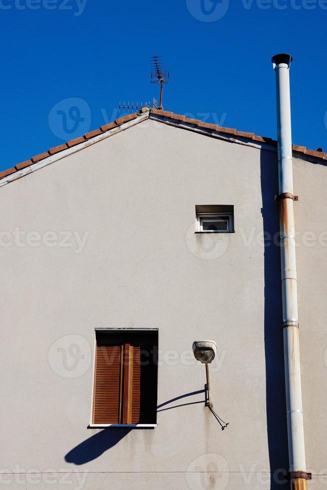 chimney on the rooftop of the house photo