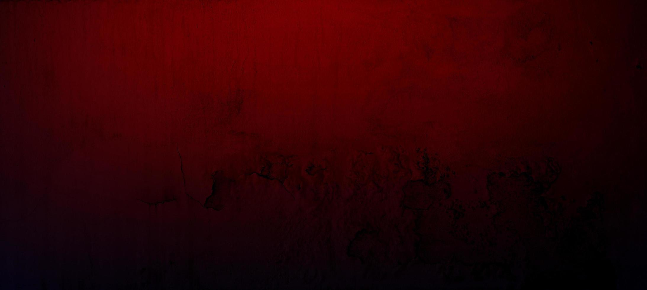 Grunge red concrete cement wall with crack for texture background photo