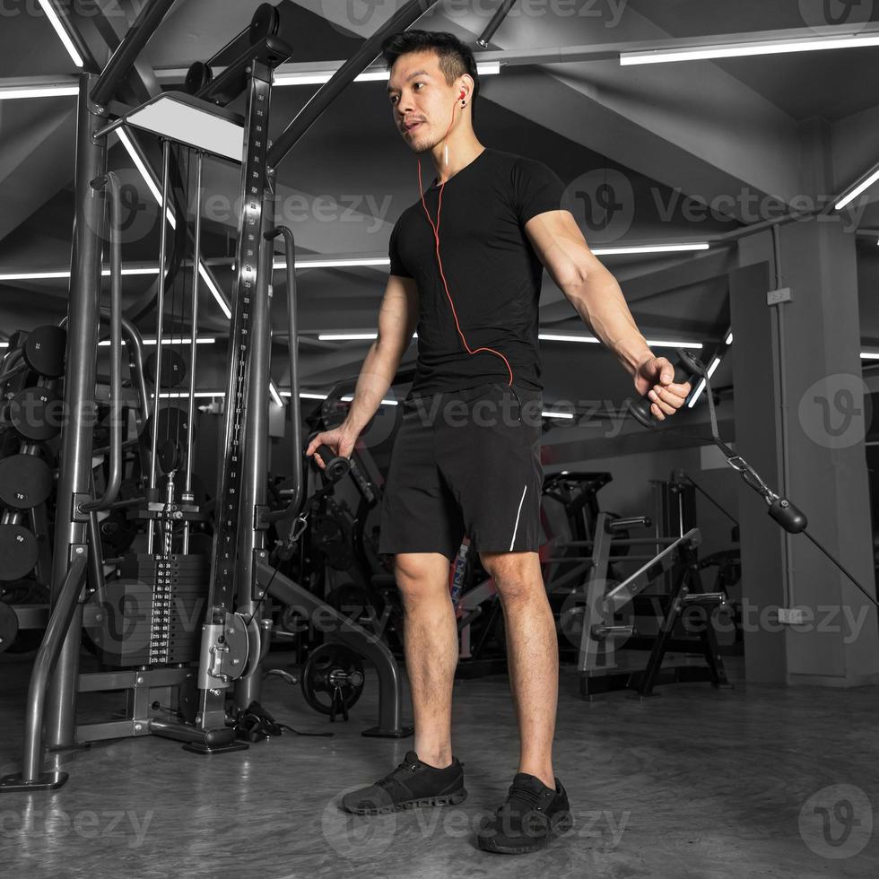 Sport man training doing exercise in gym photo