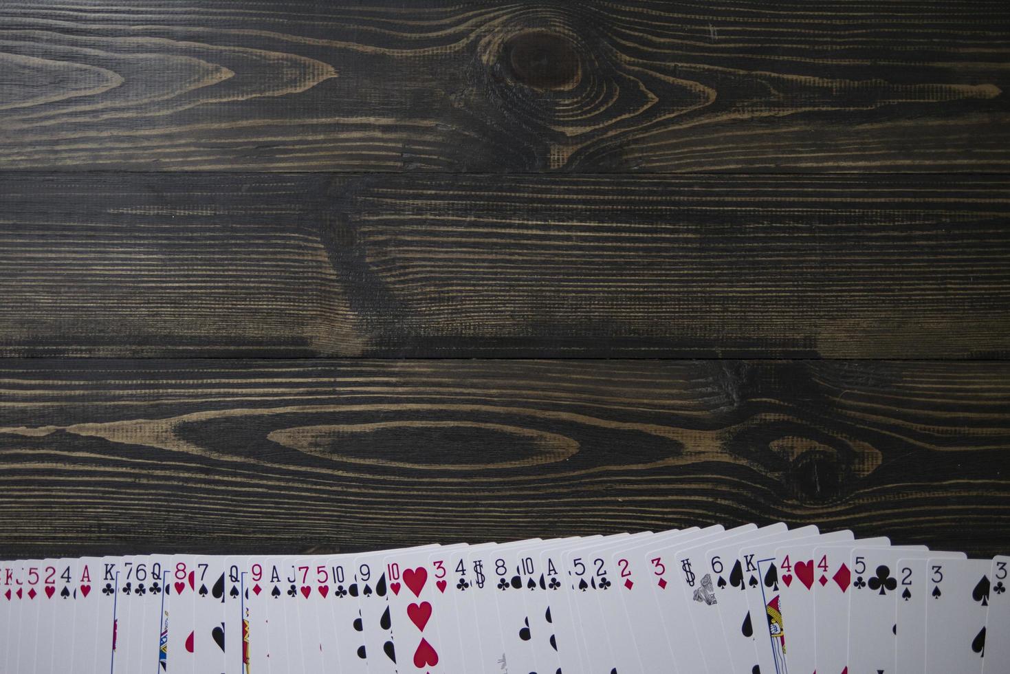 playing cards on the table beautiful wooden background copy space photo