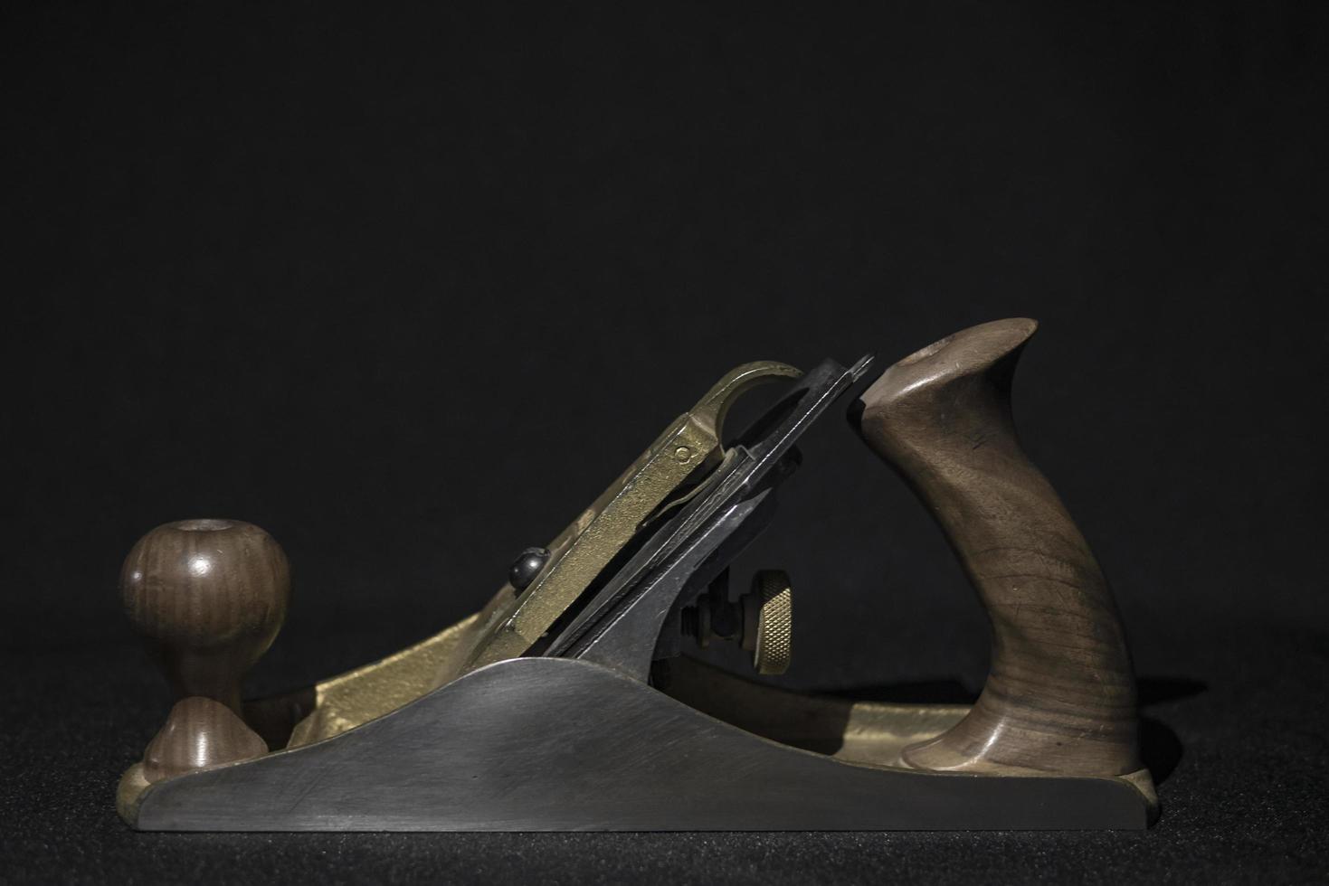 hand plane on a black background wallpaper photo