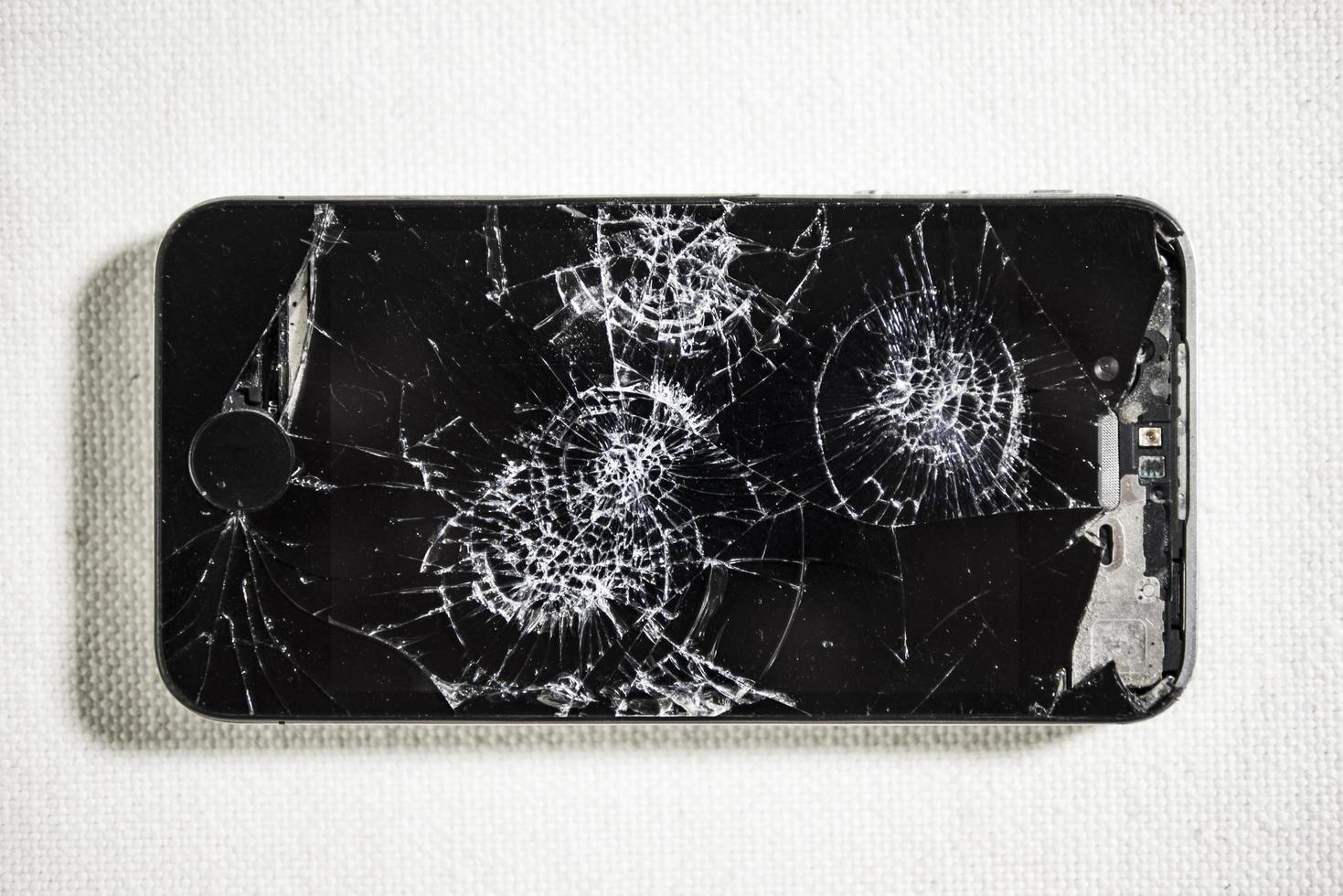 black broken phone on white background photo