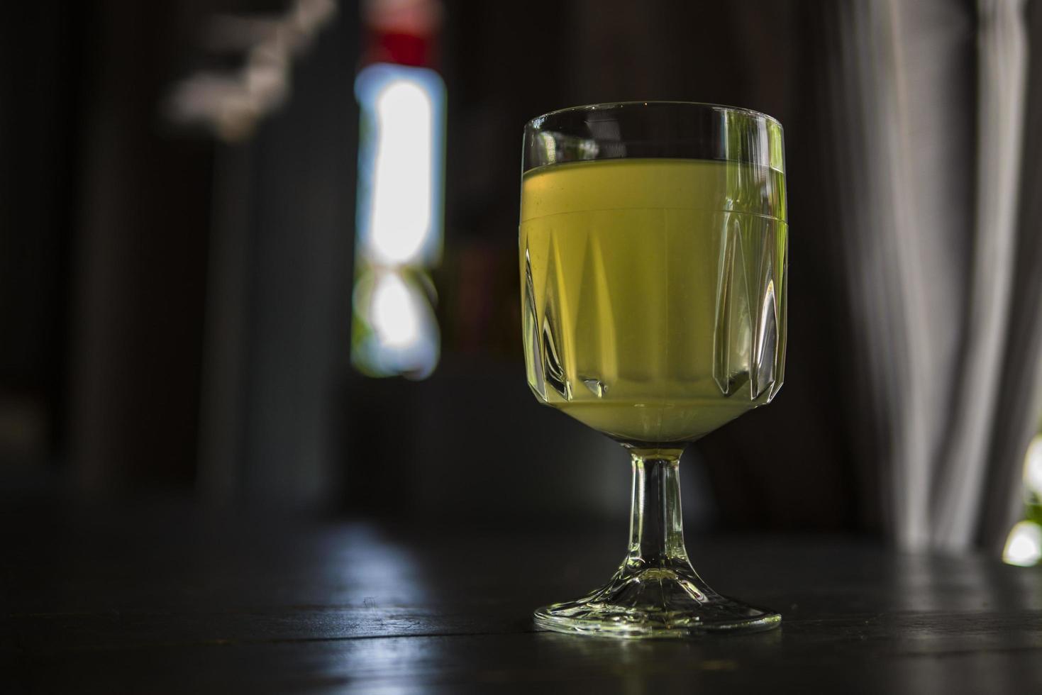 wine glass with lemonade in a summer cafe photo