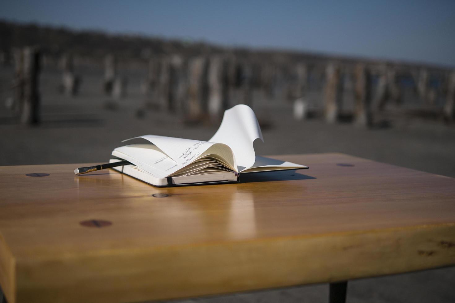 Notebook on the table in nature photo