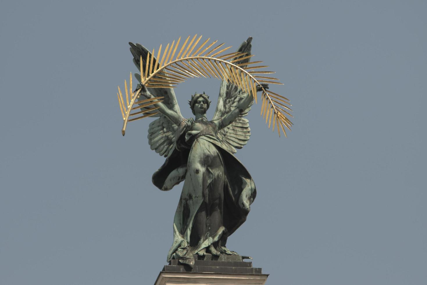 bronze sculpture genius with palm leaf and wings on the roof lviv opera photo