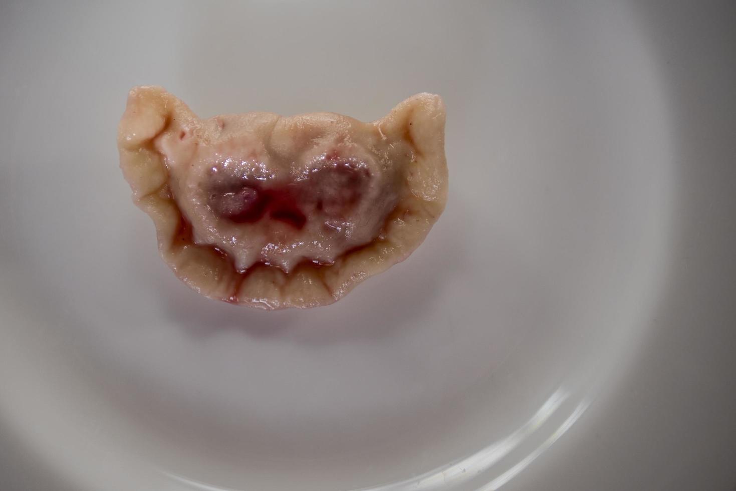 dumplings with cherries in the form of a terrible muzzle dracula vampire photo