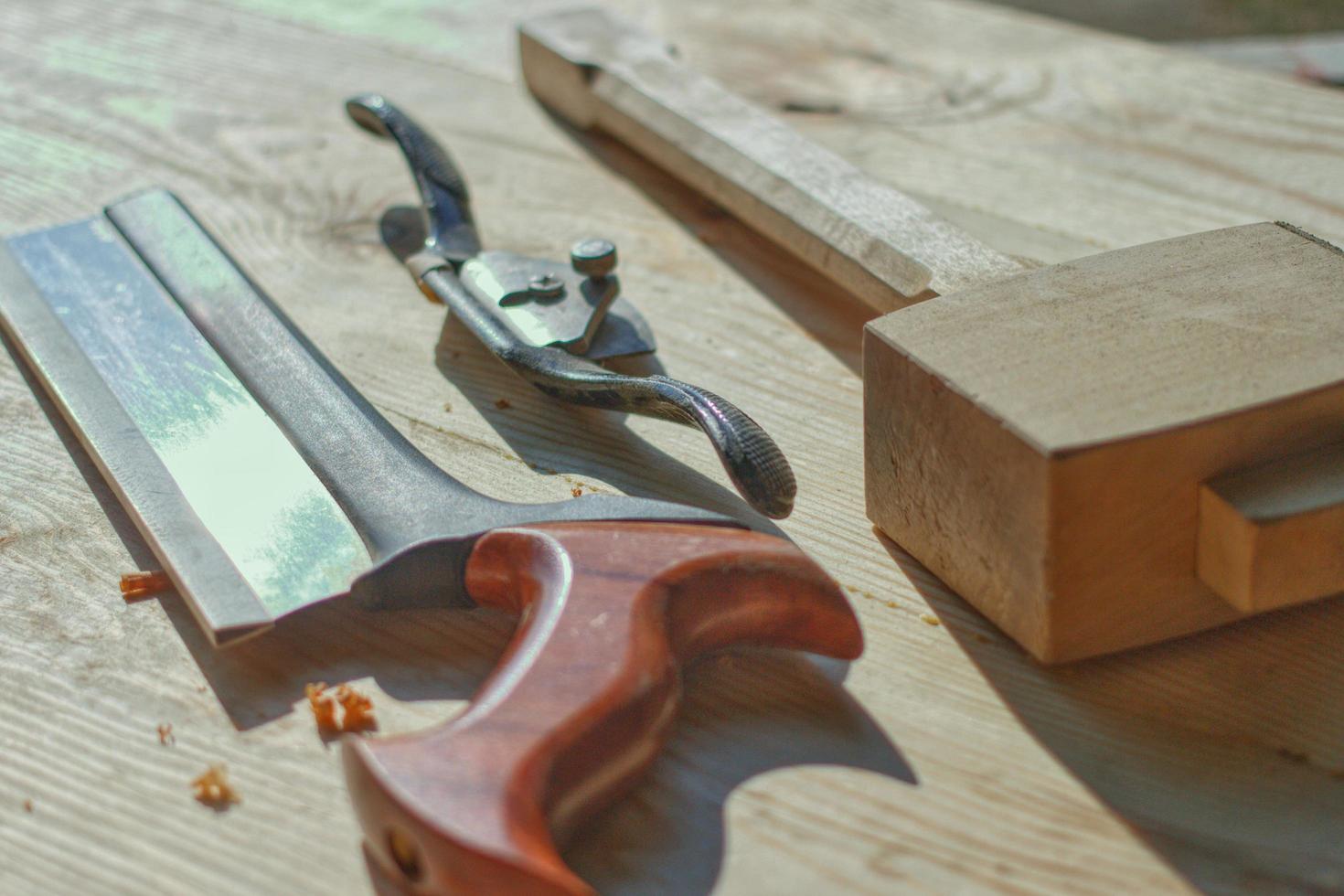 dovetail saw spoke shave and wood hammer photo