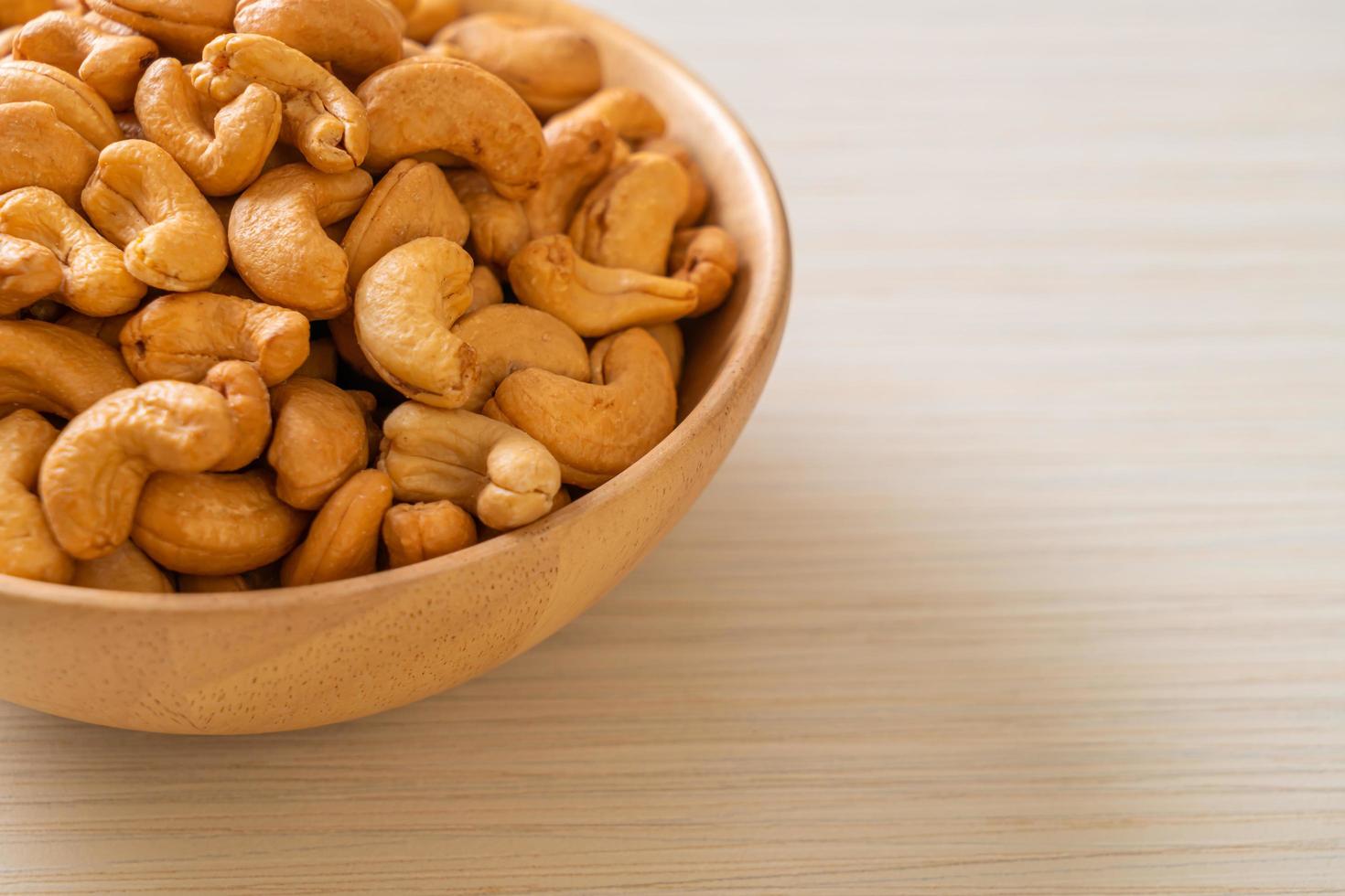 Cashew nuts in wooden bowl photo