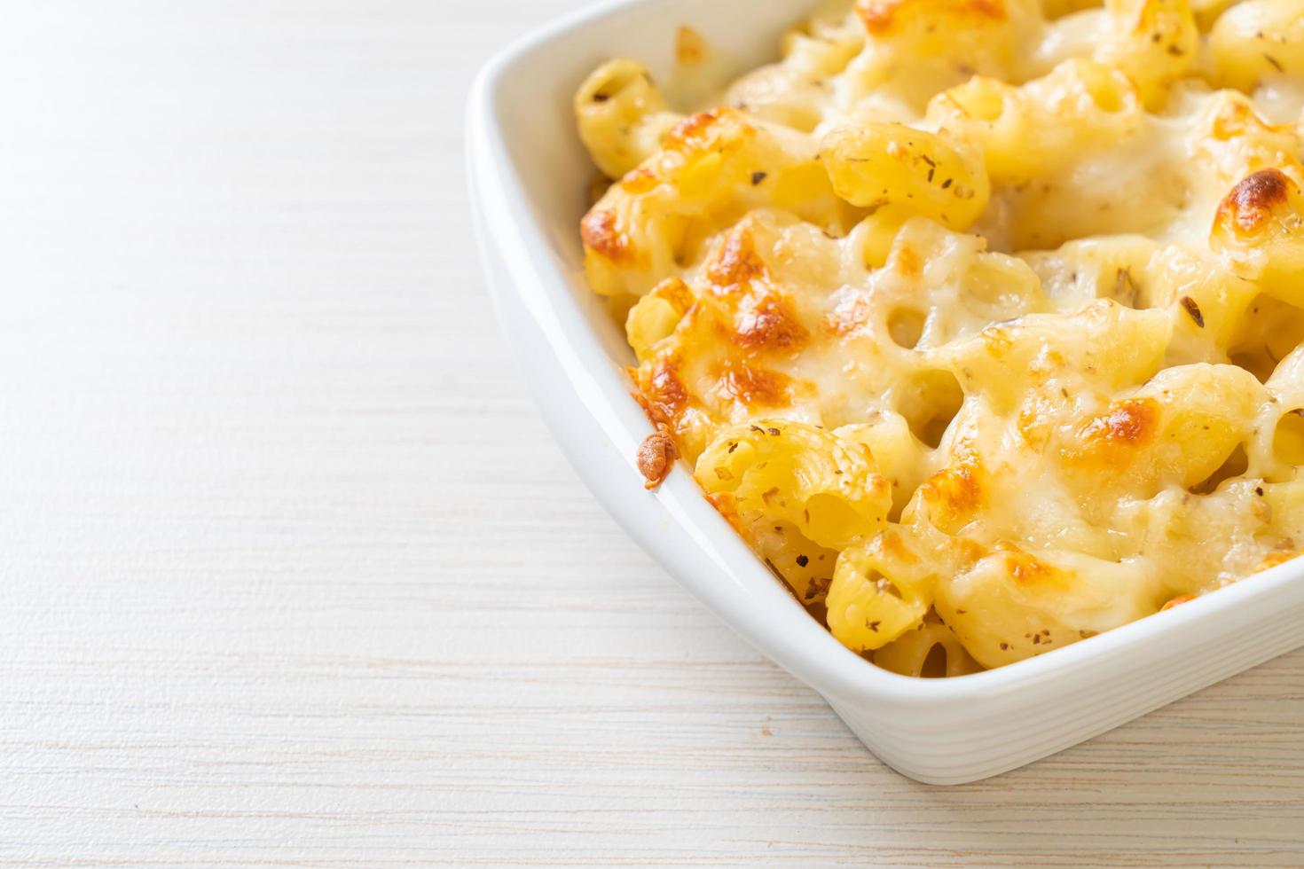 American mac and cheese macaroni pasta in cheesy sauce photo