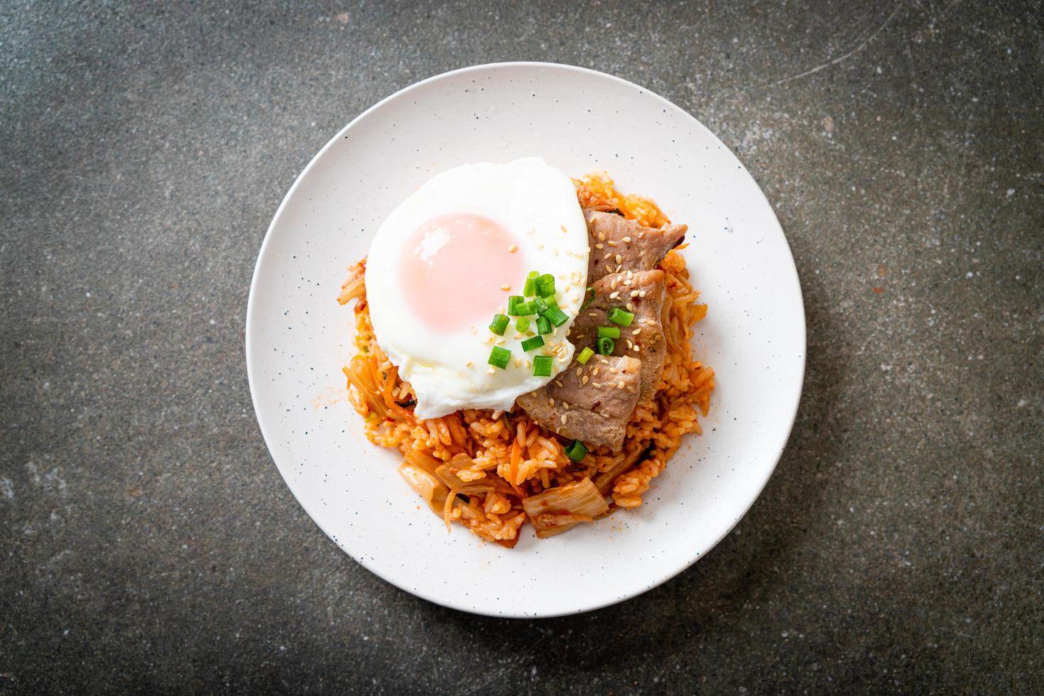 Kimchi fried rice with fried egg and pork photo