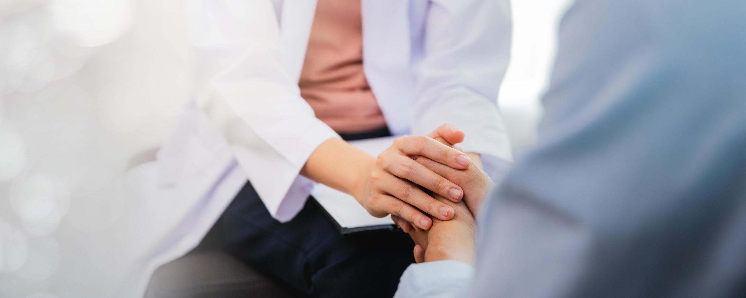 Close up hand of Asian professional psychologist doctor consulting to patient in room or hospital exam room, mental health concept photo