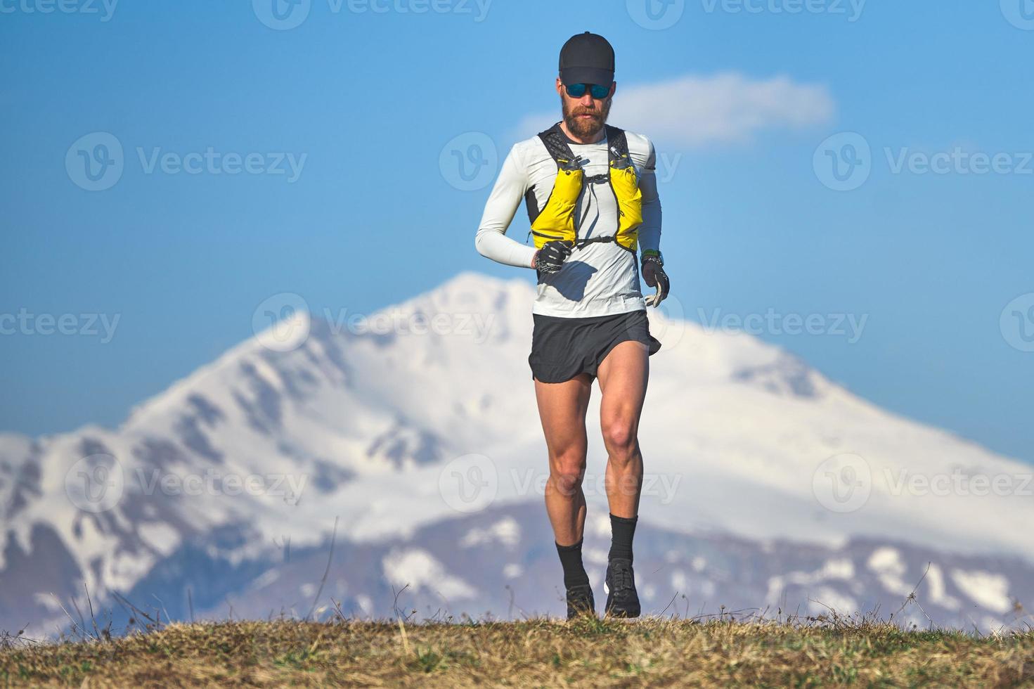 Man travel athlete in the mountains in high altitude photo