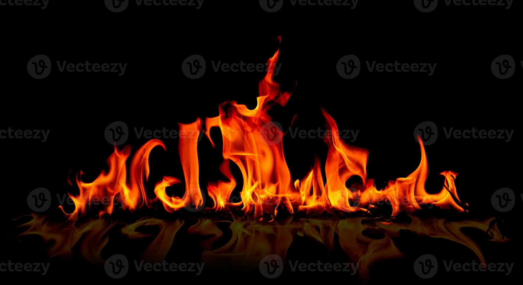 Fire flames on abstract art black background, burning red hot sparks rise, fiery orange glowing flying particles photo