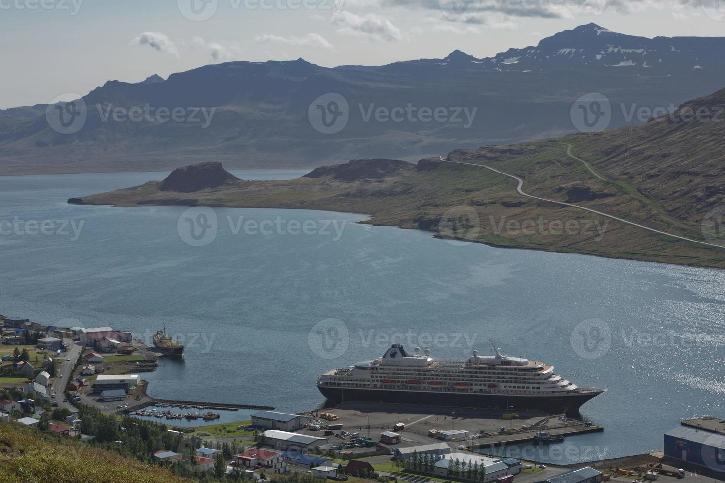 Cruise ship docking in small town of Eskifjodur located in east Iceland photo