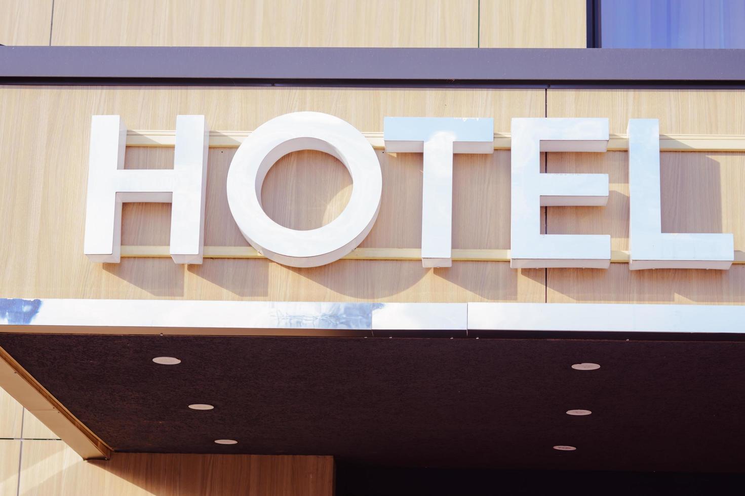 Hotel inscription on the entrance of hotel photo