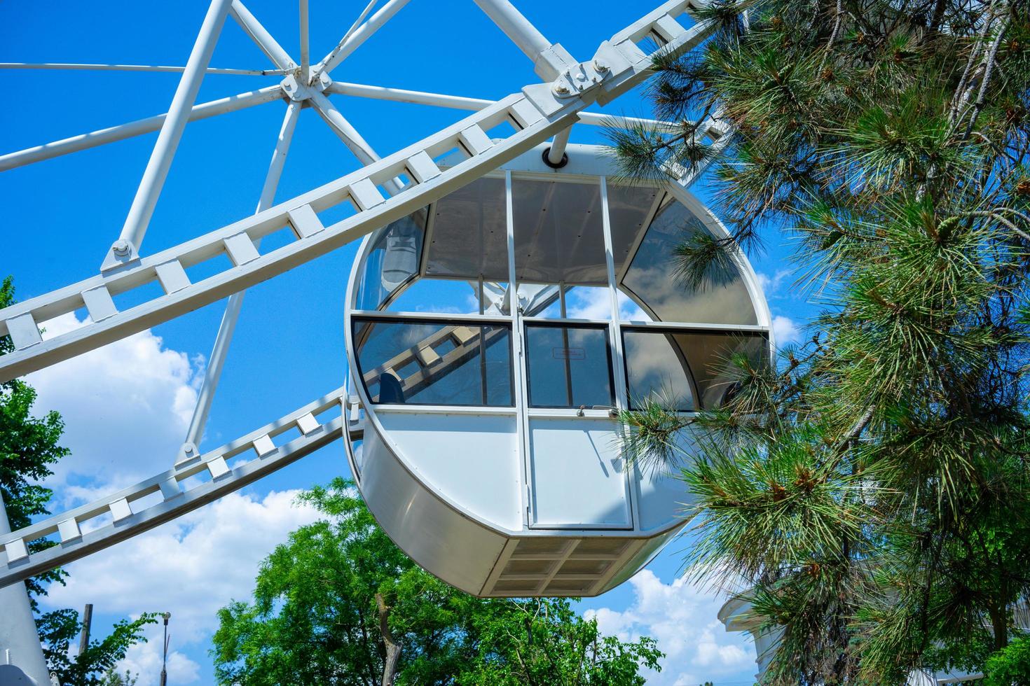 Beautiful and modern Ferris wheel on blue sky background photo