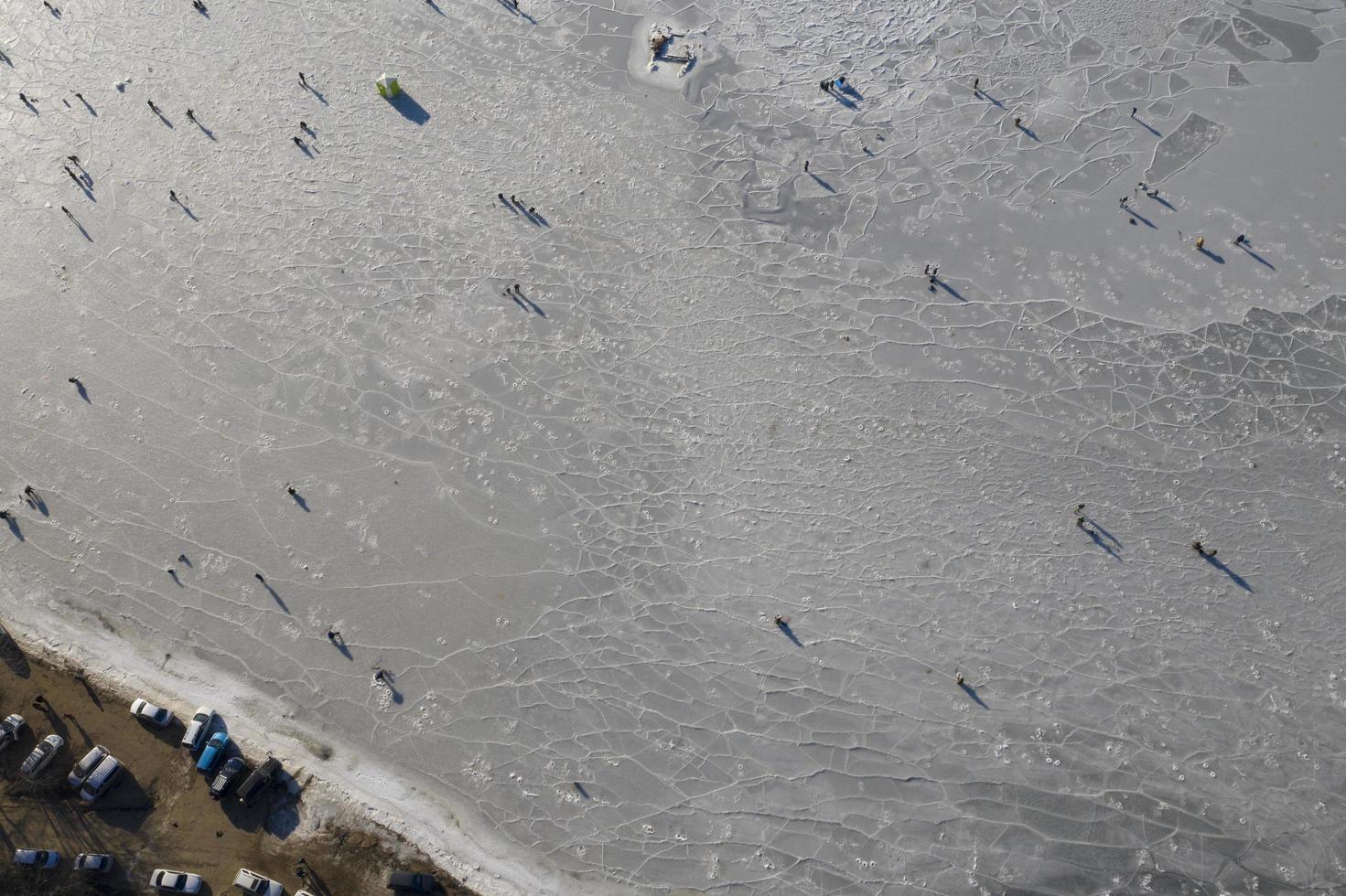 Aerial view of the Bay in the ice with fishermen on winter fishing photo