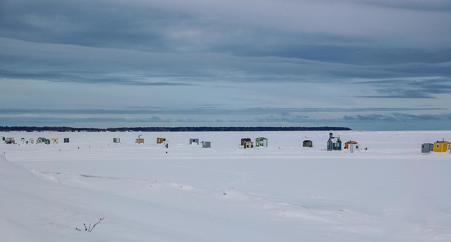 Ice fishing in the river photo