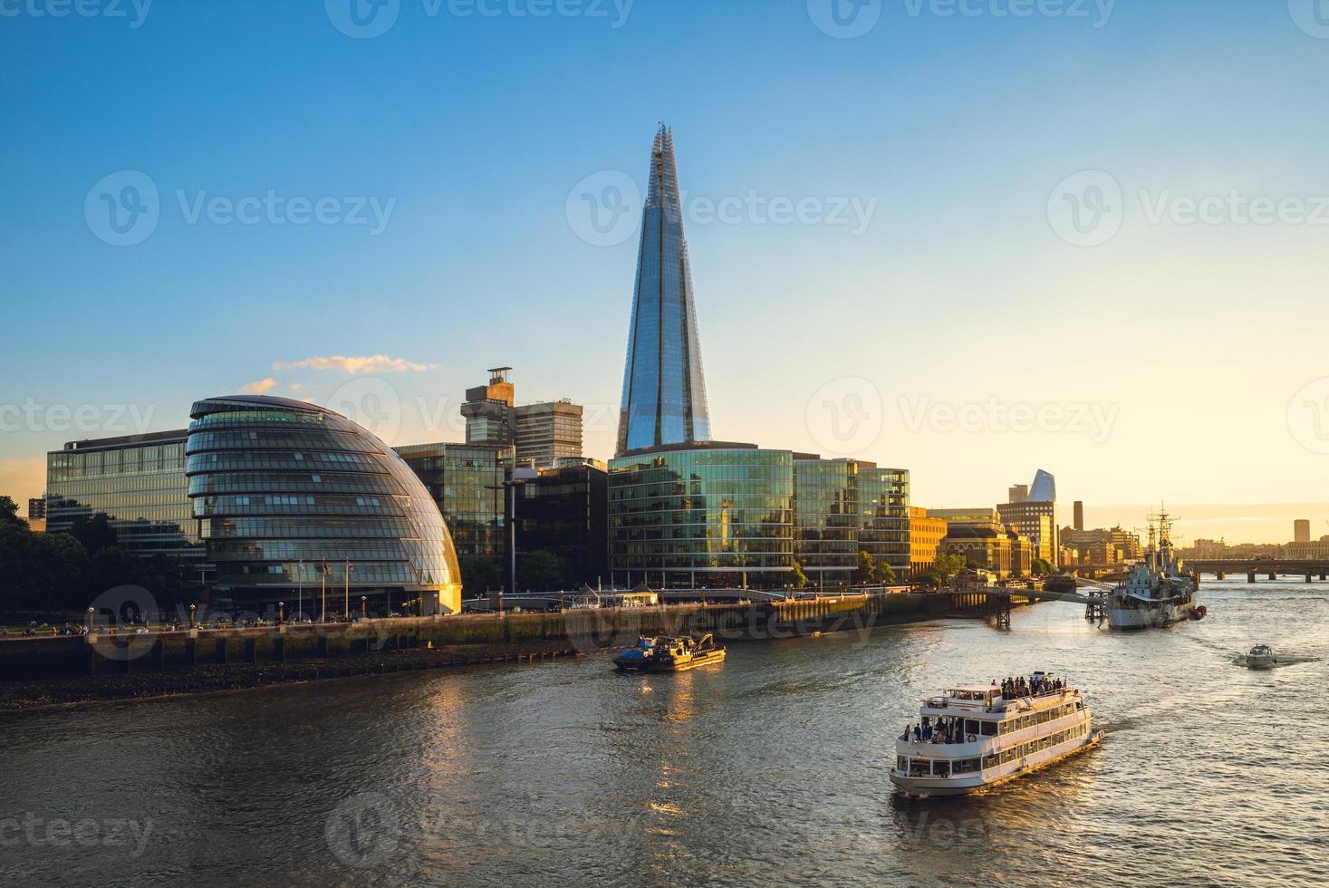 Skyline of London by the Thames river in England photo