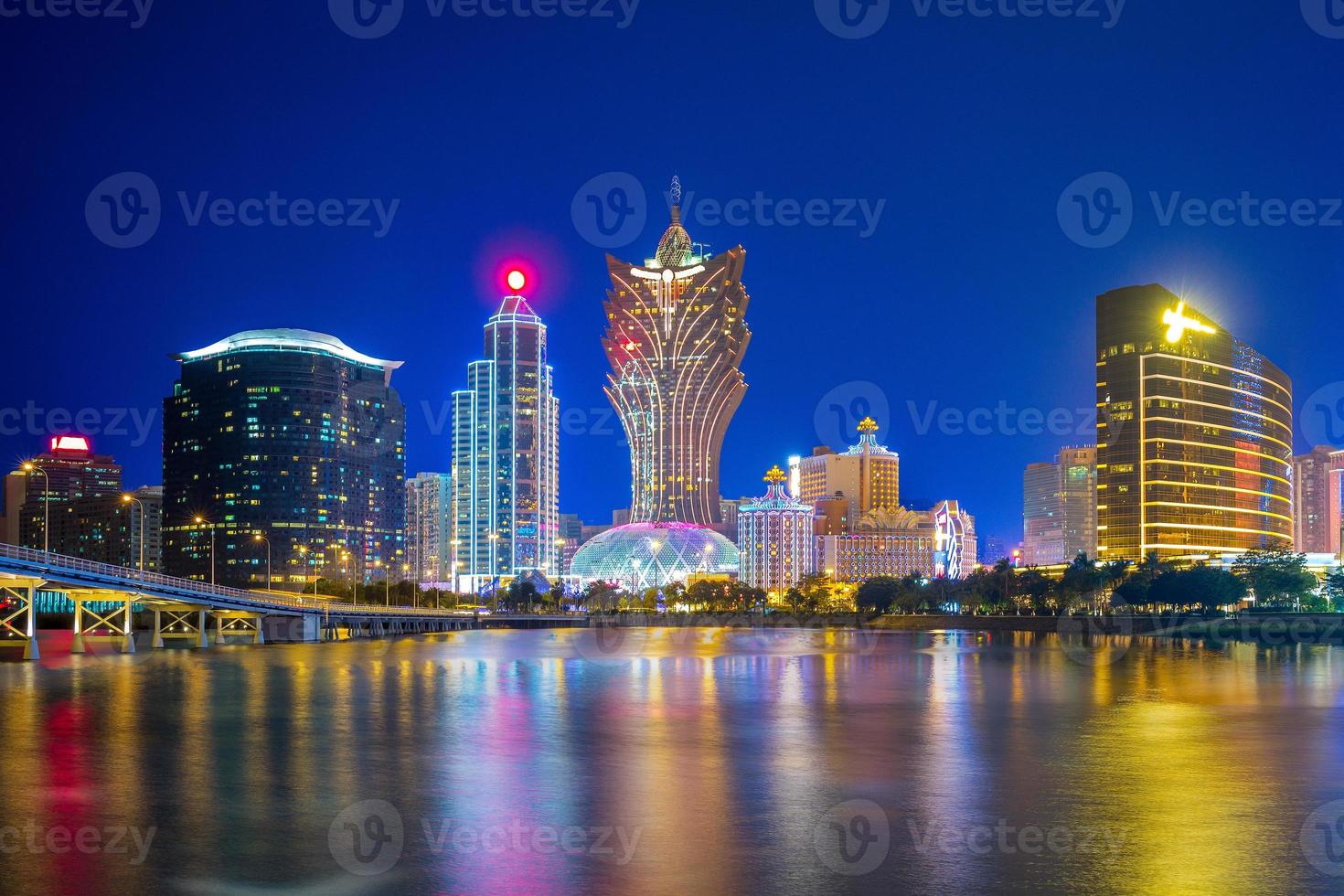 Skyline of Macau by the sea at night in China photo