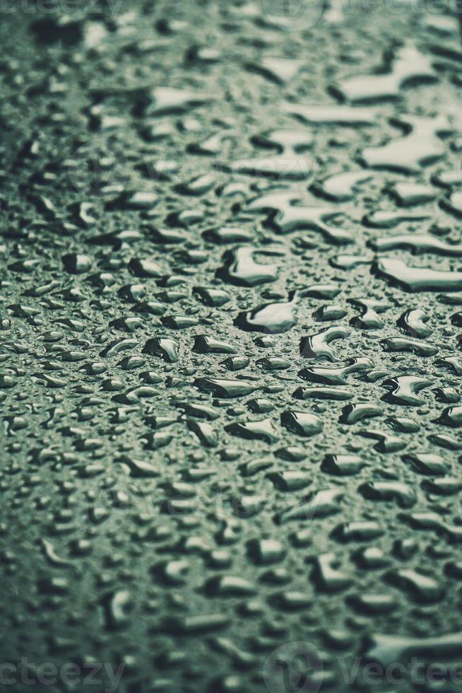 raindrops on the gray ground textured background photo