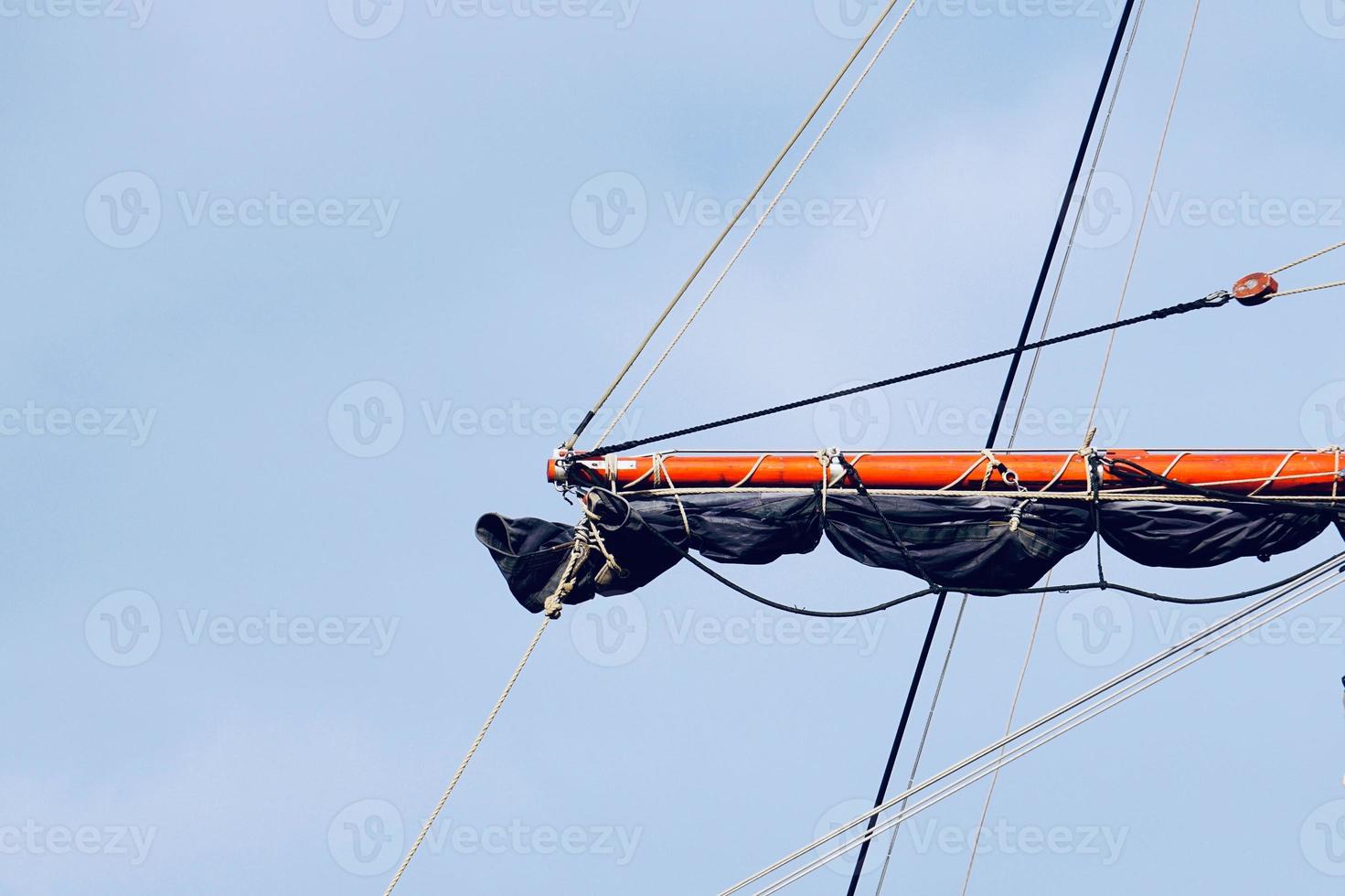 sailboat wooden mast in the seaport photo